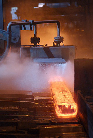 Industrial Photography, Steel Bloom entering roller area in steel fabrication, Workington, UK